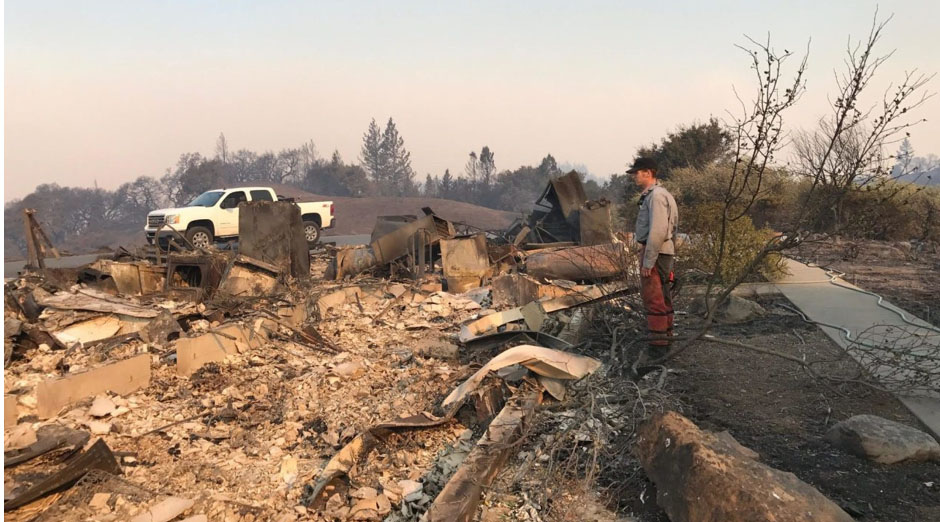 Jake Olsan surveys the scant remains of his family's home in rural Sonoma County, Oct. 2017 (Photo/Courtesy Jeremy Olsan and www.jweekly.com)