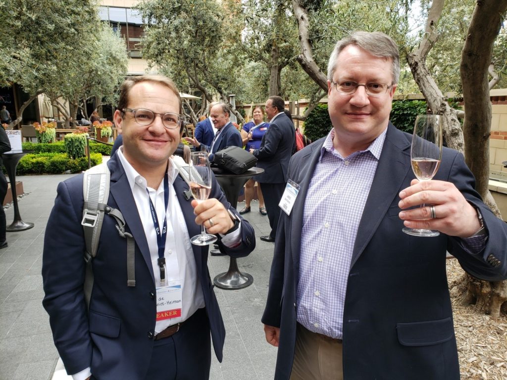 Two guys with wine glasses