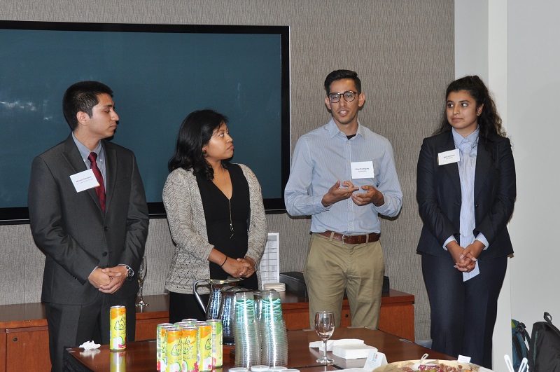 image of Michael Damasco, Idalmis Vaquero, Elias Rodriguez (speaking) and Mina Arasteh.