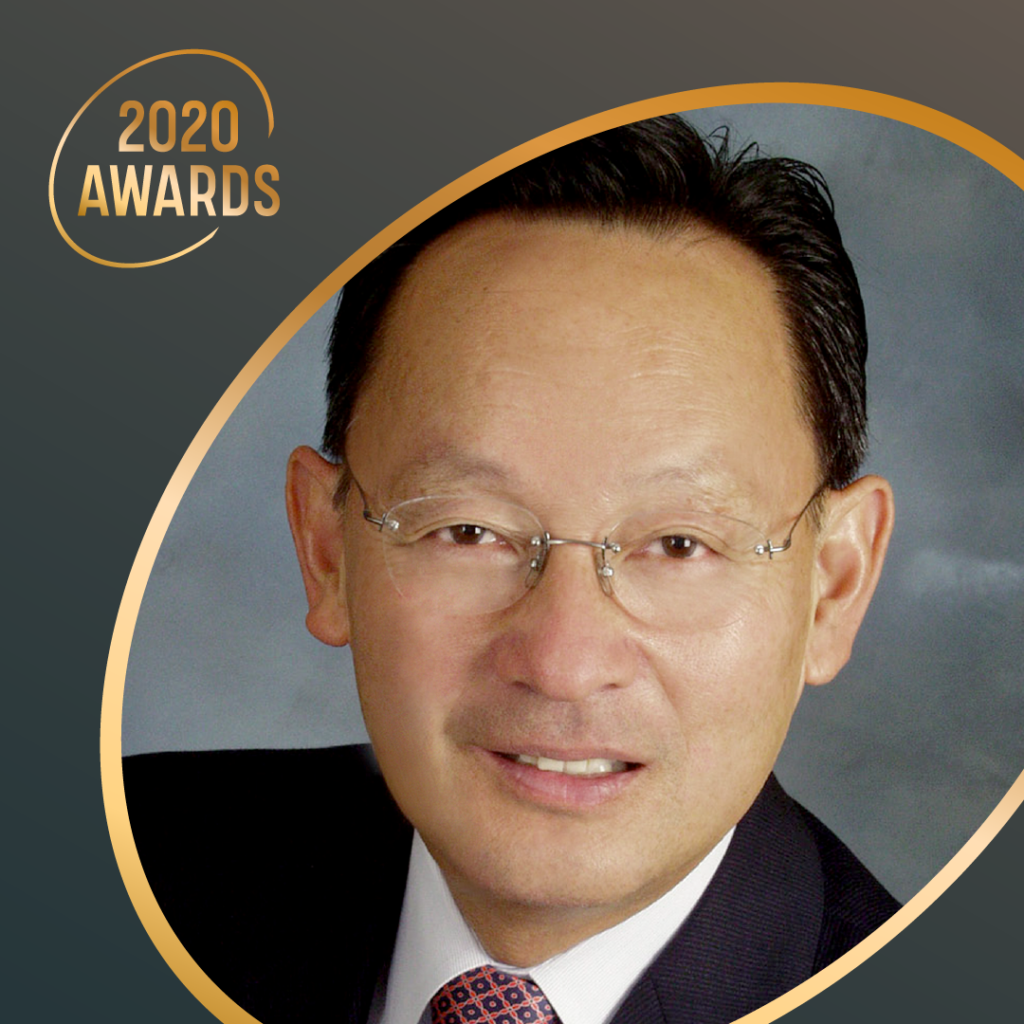 headshot of east Asian male with glasses in a suit