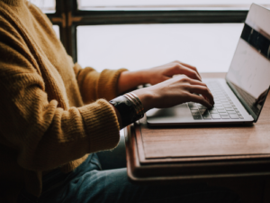 Woman typing on computer