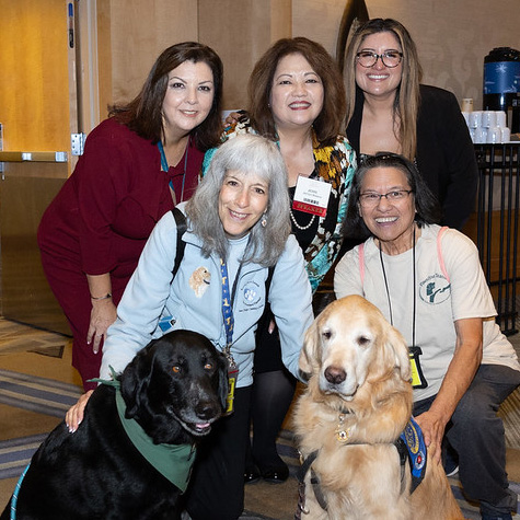 5 women from Civics Engagement and Outreach team and two dogs