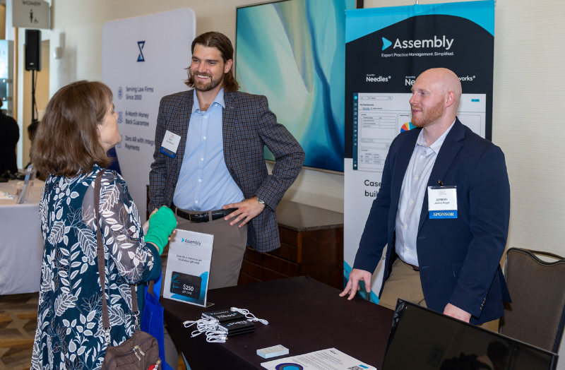Attendee interacting with exhibitor