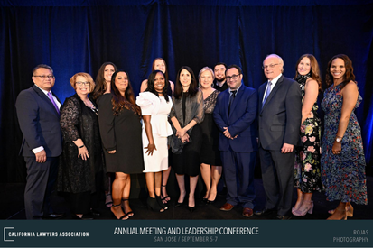Group shot of attendee on stage