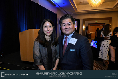 Two attendees posing for photo