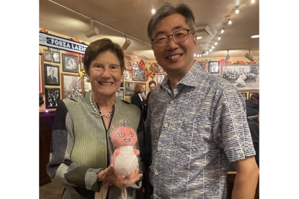 Kazuto Yamamoto presents Judge McKeown with
 the Osaka Bar Association’s official legal dragon mascot, Ryu